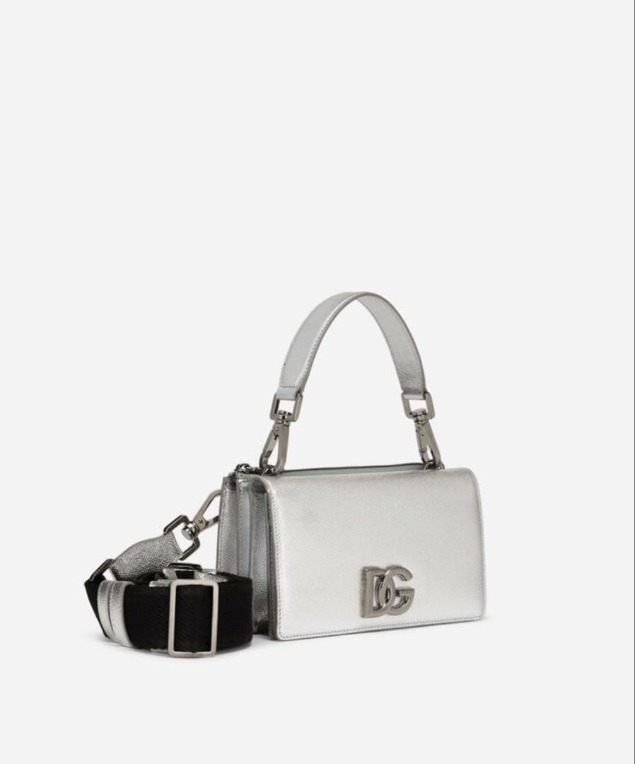 Detailed front view of the silver mini flap bag