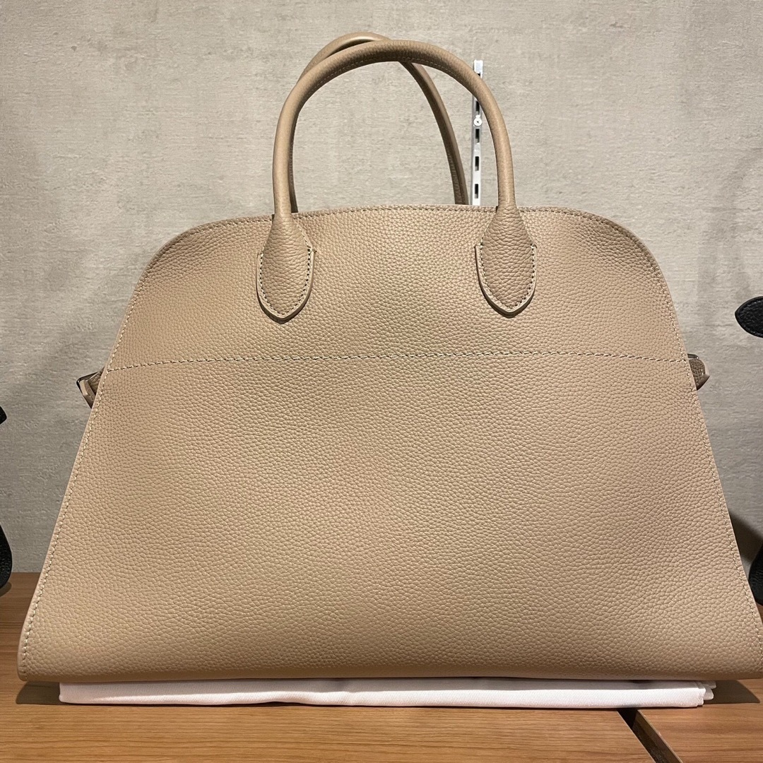 Front view of the sand grained leather dome top-handle tote