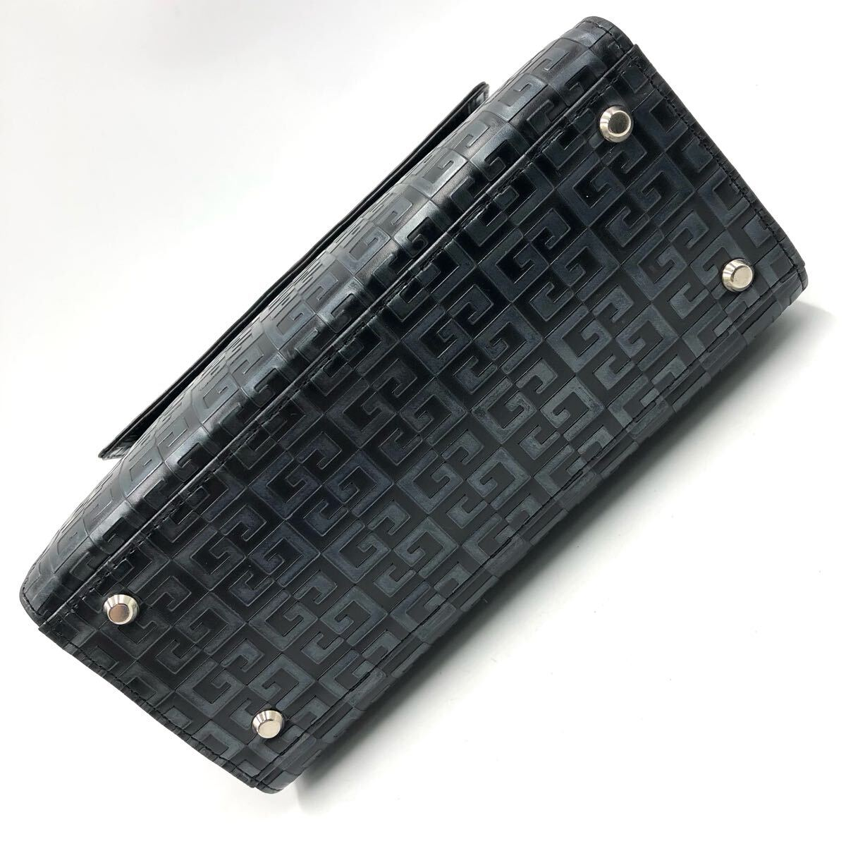 Close view of the black embossed 4G leather