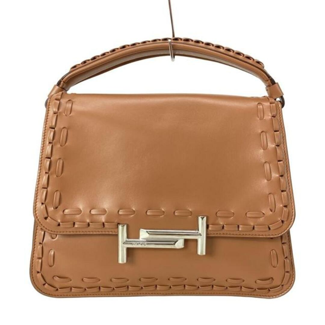 Detailed front view of the whipstitch flap bag