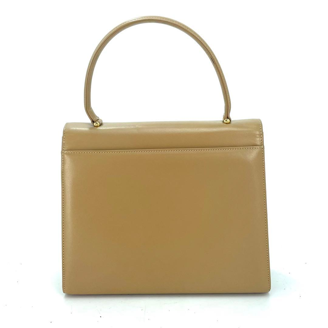 Tan Givenchy envelope top-handle bag with gold hardware