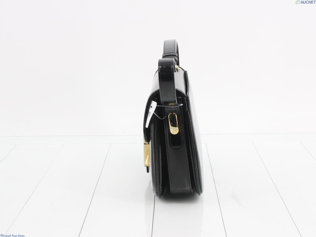 Side profile of the black patent flap bag