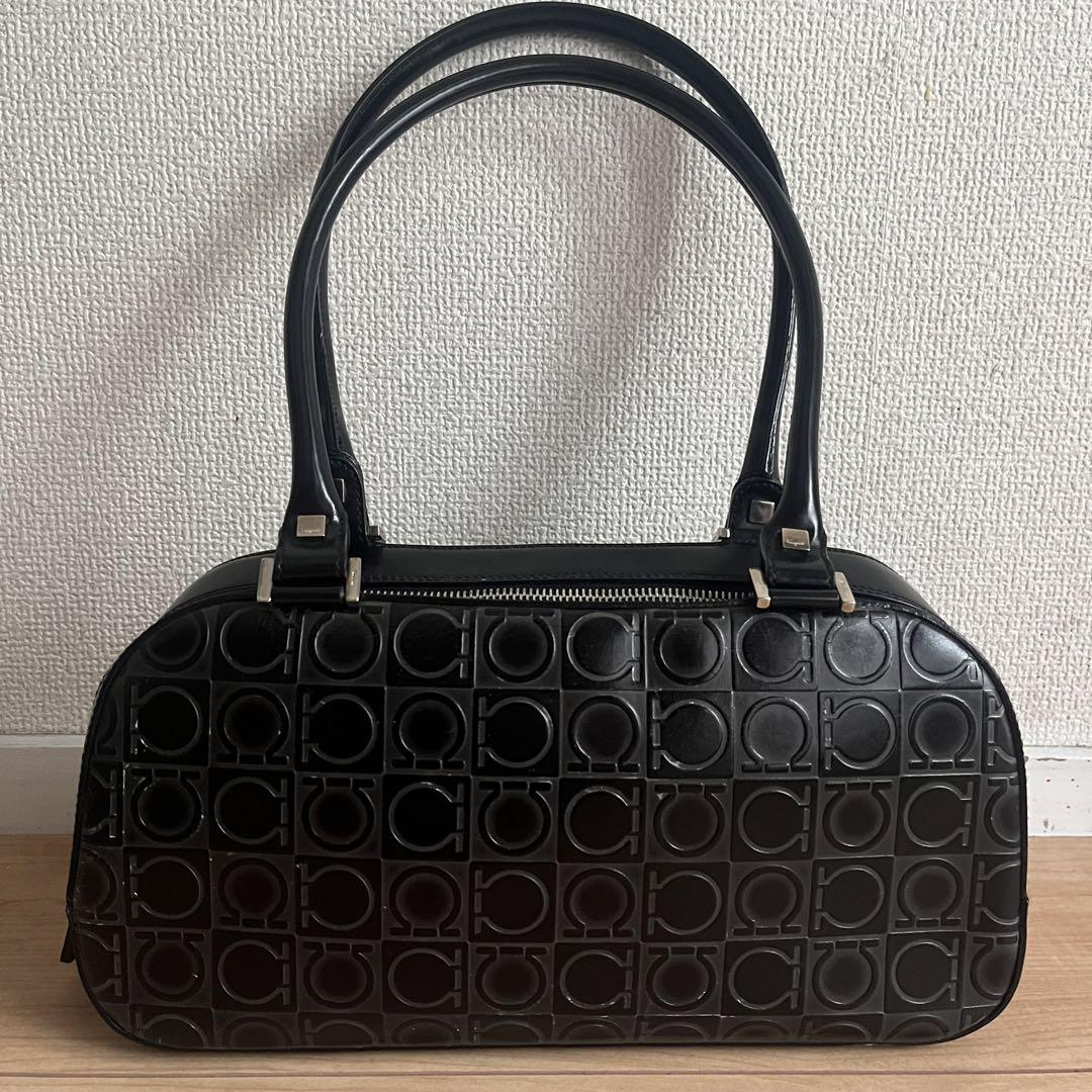 Black Ferragamo leather dome bag with embossed Gancini pattern