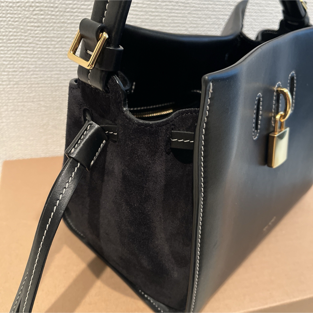 Side view showing the suede gusset and adjustable strap