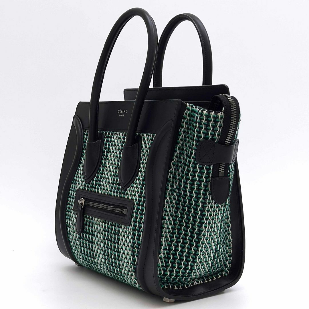 Angled view of the woven emerald and black tote