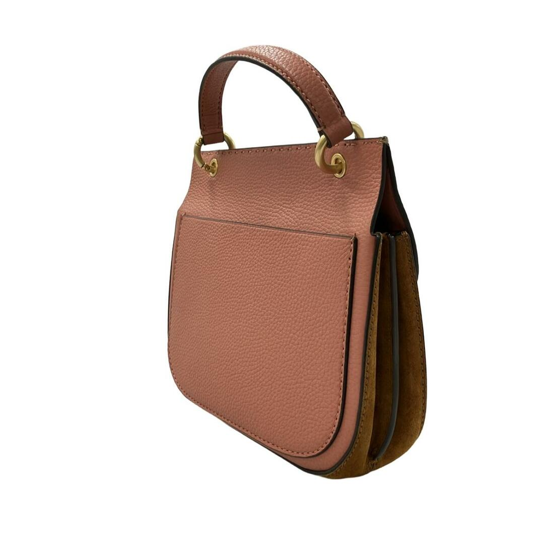 Side view of the blush mini top-handle bag