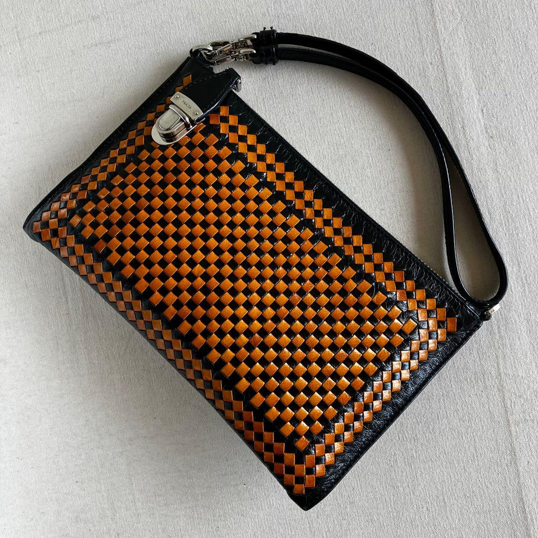 Angled view of the woven leather and shoulder strap