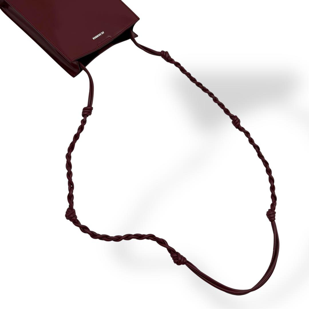 Braided knotted crossbody cord of the bordeaux mini tote