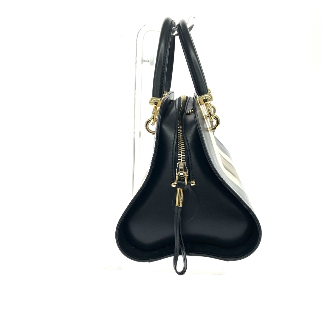 Side profile with gold zip and structured gusset