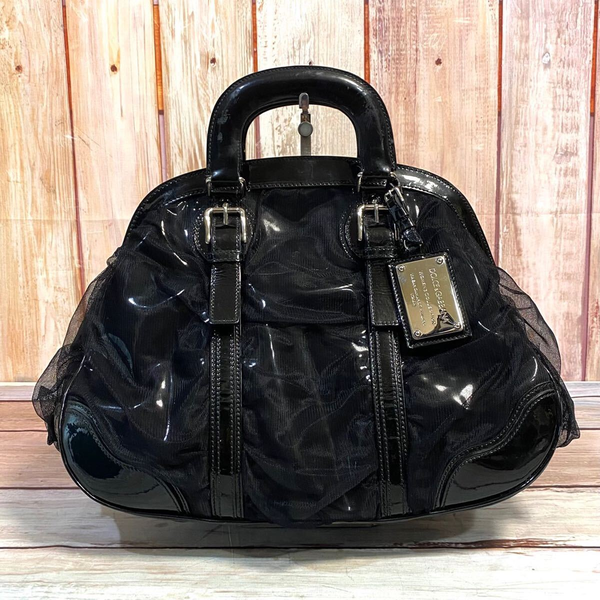 Black Dolce & Gabbana patent leather and sheer mesh dome bag